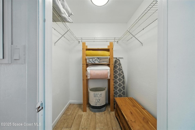 1951 Island Club Dr Unit 3-48, Melbourne, FL 32903 - walk in closet featuring wood finished floors
