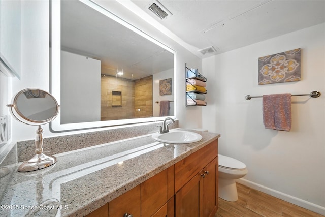 1951 Island Club Dr Unit 3-48, Melbourne, FL 32903 - bathroom featuring vanity, wood finished floors, and tiled shower
