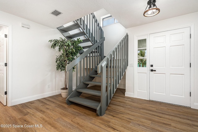 362 Nikomas Way, Melbourne Beach, FL 32951 - foyer with wood finished floors and stairs