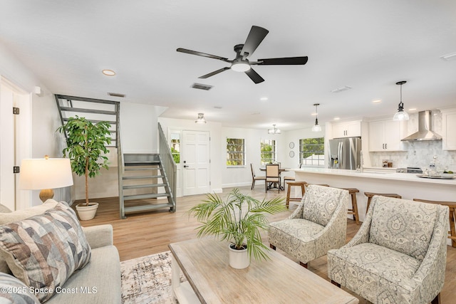 362 Nikomas Way, Melbourne Beach, FL 32951 - living room with light wood finished floors, stairs, ceiling fan, and recessed lighting