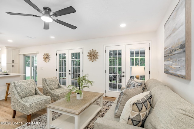 362 Nikomas Way, Melbourne Beach, FL 32951 - living room featuring french doors, light wood-style floors, ceiling fan, and recessed lighting