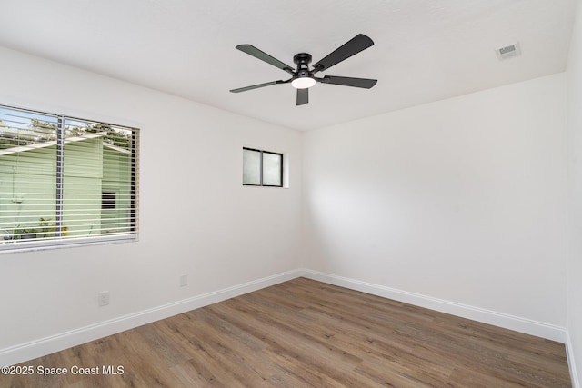 362 Nikomas Way, Melbourne Beach, FL 32951 - empty room with wood finished floors and ceiling fan