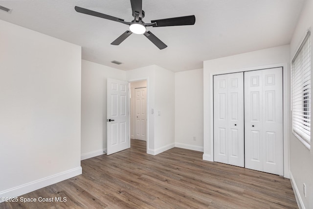 362 Nikomas Way, Melbourne Beach, FL 32951 - unfurnished bedroom with wood finished floors, a closet, and ceiling fan