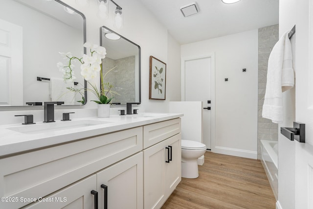 362 Nikomas Way, Melbourne Beach, FL 32951 - full bathroom with double vanity and wood finished floors