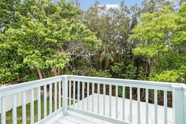362 Nikomas Way, Melbourne Beach, FL 32951 - wooden terrace with view of wooded area