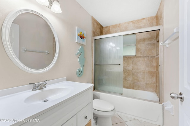 1745 Crane Creek Blvd, Melbourne, FL 32940 - bathroom featuring vanity, tile patterned floors, and bath / shower combo with glass door