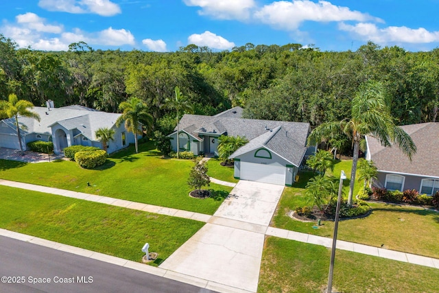 1745 Crane Creek Blvd, Melbourne, FL 32940 - view from above of property with a forest