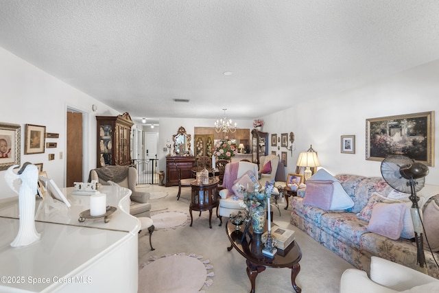 313 La Paloma Ln, Titusville, FL 32780 - living area with light colored carpet, a textured ceiling, and a chandelier