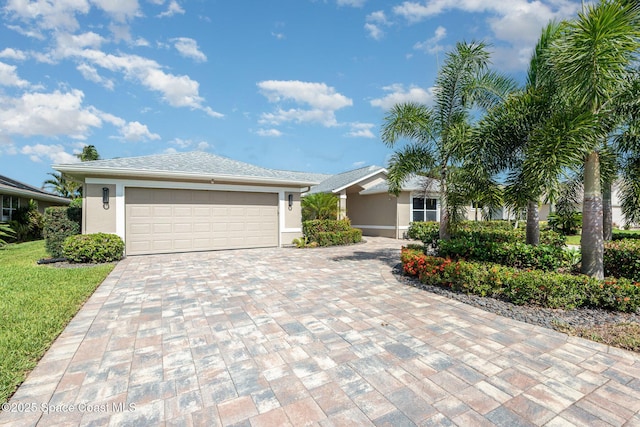 1471 Cypress Trace Dr, Melbourne, FL 32940 - ranch-style house with decorative driveway, stucco siding, a garage, and a front lawn