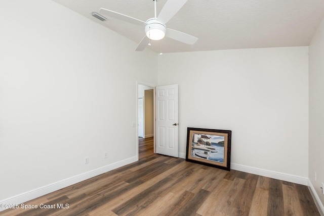 1471 Cypress Trace Dr, Melbourne, FL 32940 - unfurnished room with vaulted ceiling, wood finished floors, and ceiling fan