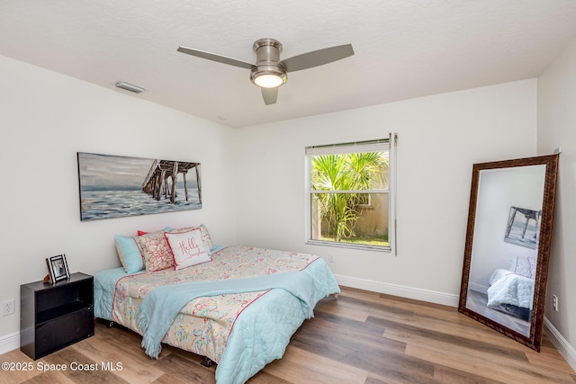 1471 Cypress Trace Dr, Melbourne, FL 32940 - bedroom with wood finished floors and ceiling fan