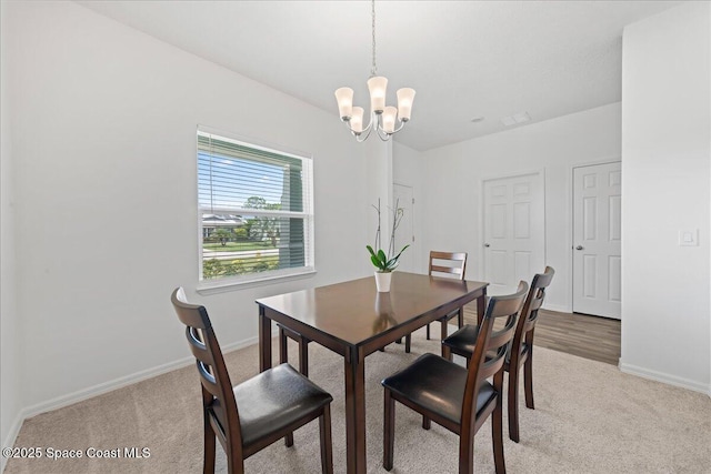 780 Consumer St SE, Palm Bay, FL 32909 - dining area with light carpet and a chandelier