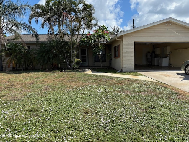 978 Nagle Dr, Rockledge, FL 32955 - ranch-style home with brick siding, driveway, a front yard, and an attached garage