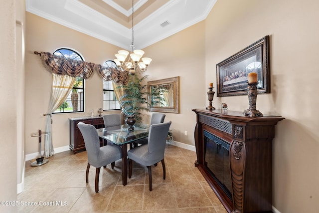 3079 Levanto Dr, Melbourne, FL 32940 - dining room featuring a chandelier, crown molding, light tile patterned floors, and a raised ceiling