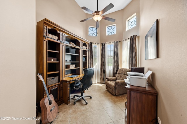 3079 Levanto Dr, Melbourne, FL 32940 - home office featuring ceiling fan, light tile patterned floors, and a high ceiling
