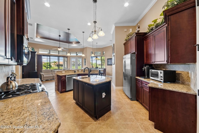 3079 Levanto Dr, Melbourne, FL 32940 - kitchen with stainless steel appliances, a kitchen island with sink, decorative backsplash, light tile patterned flooring, and recessed lighting