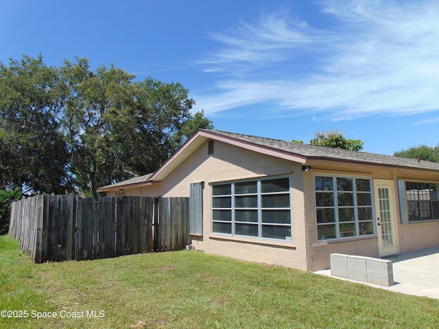 1943 Bradway St NE, Palm Bay, FL 32905 - view of side of home with stucco siding
