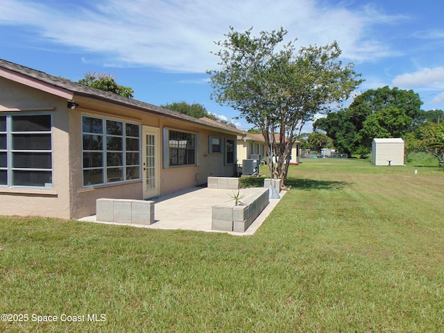 1943 Bradway St NE, Palm Bay, FL 32905 - view of grassy yard with a patio area