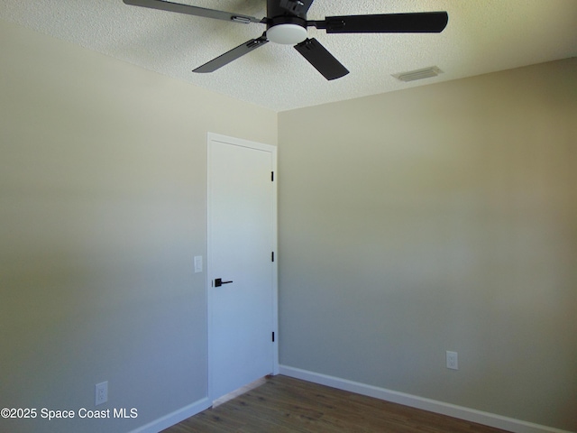 1943 Bradway St NE, Palm Bay, FL 32905 - empty room with wood finished floors, a ceiling fan, and a textured ceiling