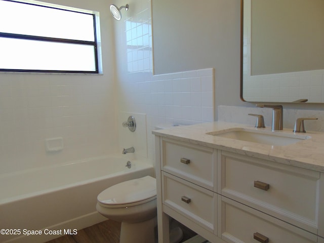 1943 Bradway St NE, Palm Bay, FL 32905 - bathroom featuring vanity, bathtub / shower combination, wood finished floors, and backsplash