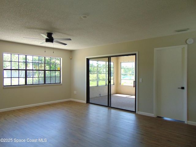 1943 Bradway St NE, Palm Bay, FL 32905 - unfurnished room featuring wood finished floors, ceiling fan, a textured ceiling, and a smoke detector