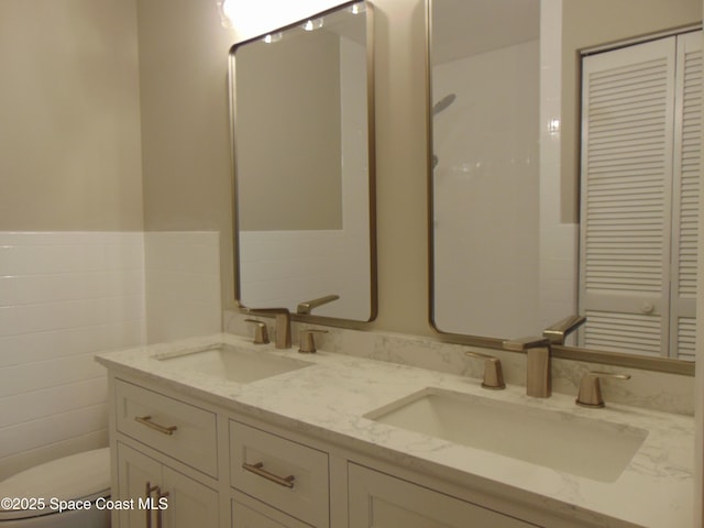 1943 Bradway St NE, Palm Bay, FL 32905 - bathroom featuring double vanity and toilet
