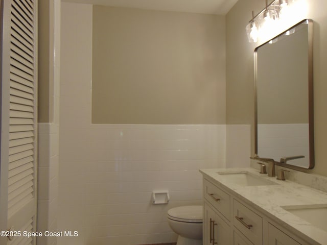 1943 Bradway St NE, Palm Bay, FL 32905 - full bathroom featuring double vanity and a wainscoted wall