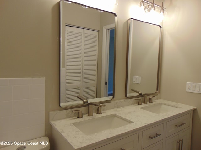 1943 Bradway St NE, Palm Bay, FL 32905 - full bath with double vanity and a closet