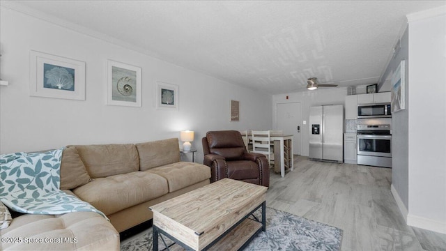 4800 Ocean Beach Blvd Unit 226, Cocoa Beach, FL 32931 - living room with ceiling fan and light wood-type flooring