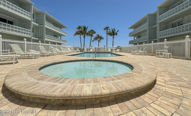 4800 Ocean Beach Blvd Unit 226, Cocoa Beach, FL 32931 - community pool featuring a patio