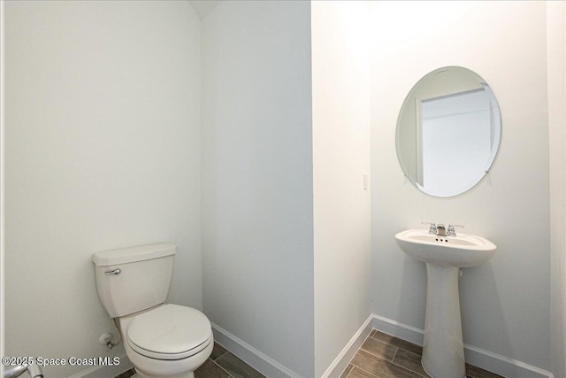 3538 Angler Dr, Ft Pierce, FL 34947 - bathroom featuring toilet and wood finished floors