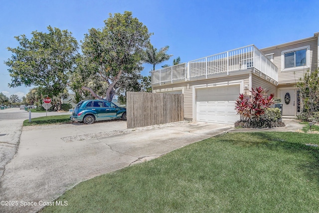 53 Emerald Ct, Satellite Beach, FL 32937 - view of side of property with concrete driveway, a balcony, and a garage