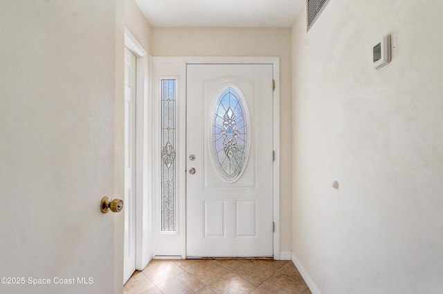 53 Emerald Ct, Satellite Beach, FL 32937 - entryway featuring light tile patterned floors and baseboards
