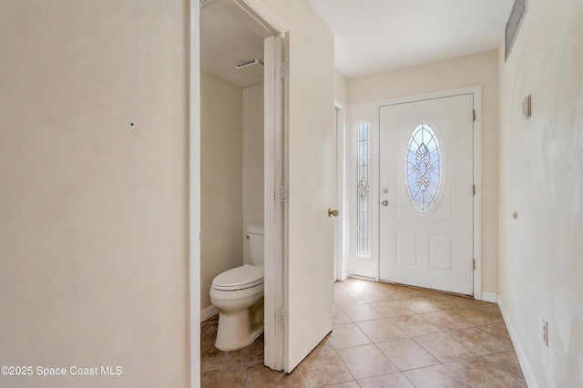 53 Emerald Ct, Satellite Beach, FL 32937 - foyer entrance featuring light tile patterned floors and baseboards