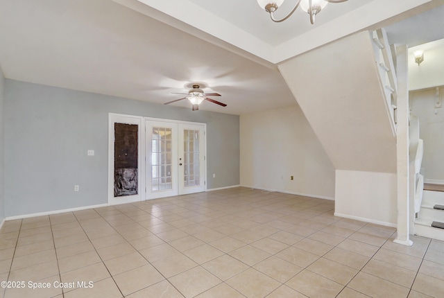53 Emerald Ct, Satellite Beach, FL 32937 - empty room featuring french doors, light tile patterned floors, ceiling fan, and a chandelier