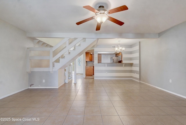 53 Emerald Ct, Satellite Beach, FL 32937 - unfurnished living room featuring a chandelier, a ceiling fan, light tile patterned floors, and stairs