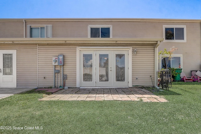 53 Emerald Ct, Satellite Beach, FL 32937 - rear view of house with french doors and a yard