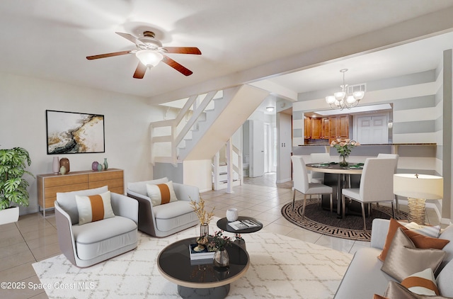 53 Emerald Ct, Satellite Beach, FL 32937 - living area with light tile patterned floors, a chandelier, stairs, and ceiling fan