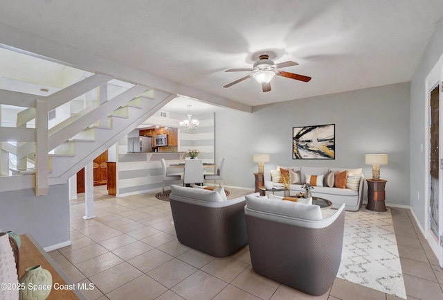 53 Emerald Ct, Satellite Beach, FL 32937 - living room featuring tile patterned flooring, ceiling fan, stairs, and a chandelier