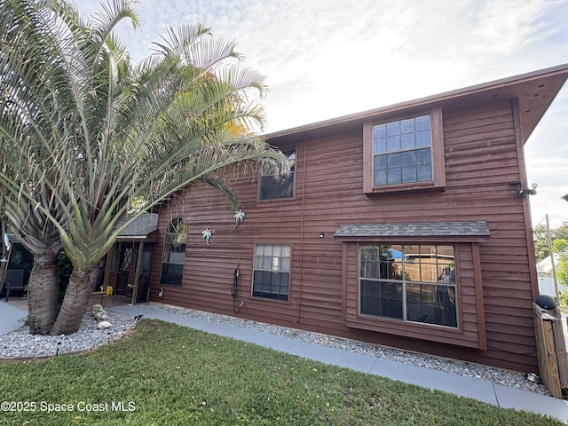 6860 Cairo Rd, Cocoa, FL 32927 - back of house with a yard