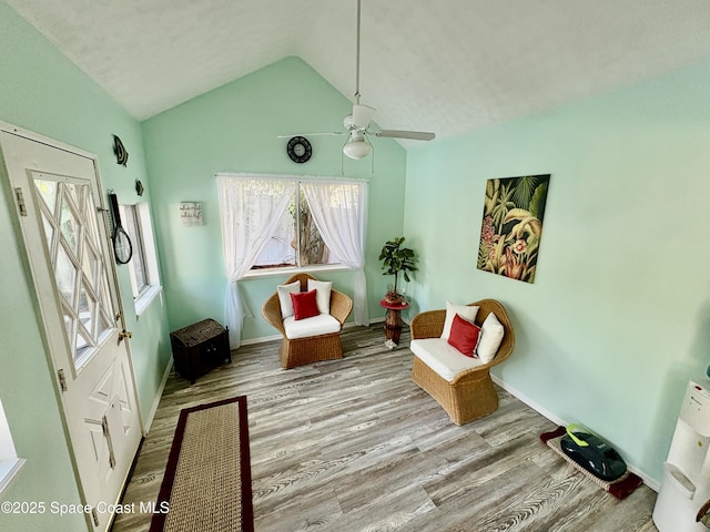 6860 Cairo Rd, Cocoa, FL 32927 - sitting room with wood finished floors, ceiling fan, and lofted ceiling