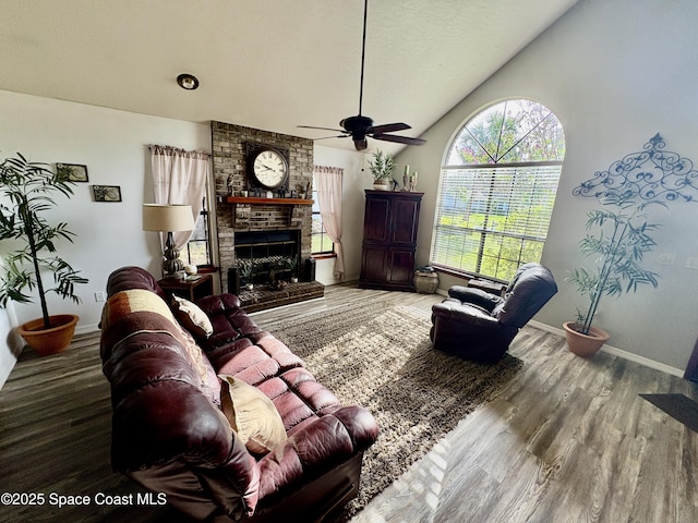 6860 Cairo Rd, Cocoa, FL 32927 - living room with a ceiling fan, vaulted ceiling, wood finished floors, and a fireplace