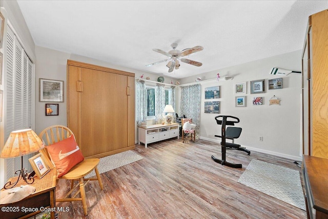 2310 Bignonia St, Melbourne, FL 32901 - exercise area with light wood finished floors and ceiling fan