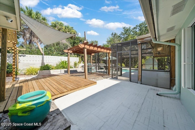 2310 Bignonia St, Melbourne, FL 32901 - fenced backyard featuring a pergola, a patio, and a deck