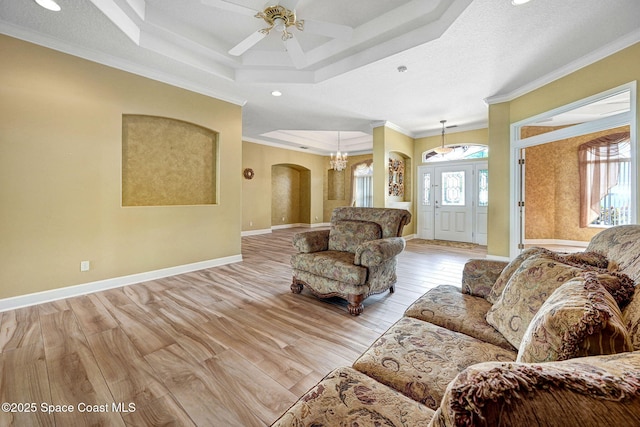 2604 Canary Isles Dr, Melbourne, FL 32901 - living room with arched walkways, a raised ceiling, ornamental molding, recessed lighting, and ceiling fan