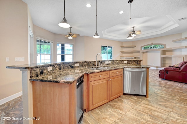 2604 Canary Isles Dr, Melbourne, FL 32901 - kitchen featuring dishwasher, a ceiling fan, open floor plan, healthy amount of natural light, and a textured ceiling