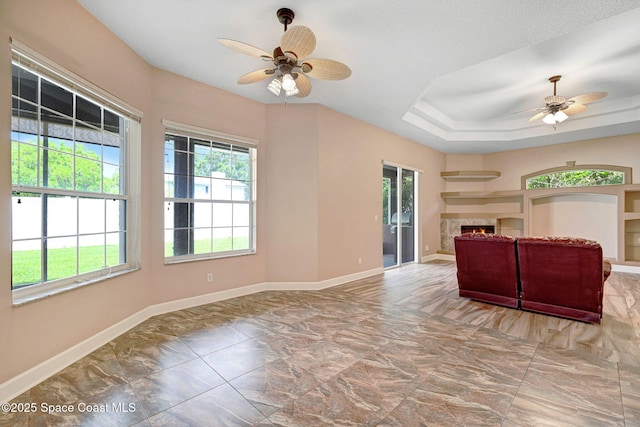 2604 Canary Isles Dr, Melbourne, FL 32901 - living room with a ceiling fan and a premium fireplace