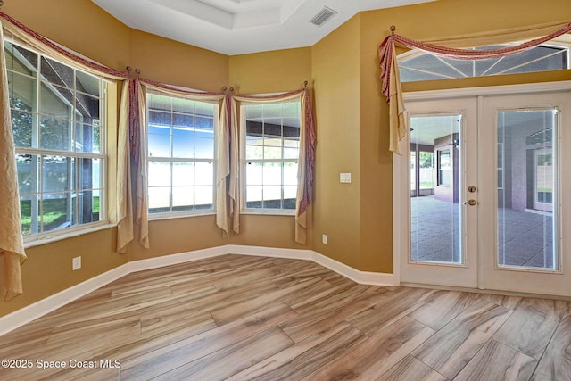 2604 Canary Isles Dr, Melbourne, FL 32901 - spare room featuring wood finished floors and french doors