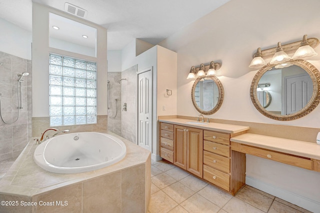 2604 Canary Isles Dr, Melbourne, FL 32901 - full bath featuring a tub with jets, walk in shower, vanity, and tile patterned floors