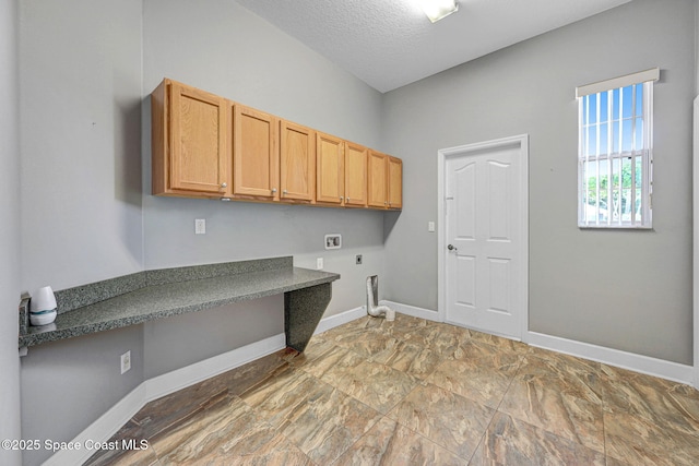 2604 Canary Isles Dr, Melbourne, FL 32901 - laundry area featuring electric dryer hookup, hookup for a washing machine, cabinet space, and a textured ceiling